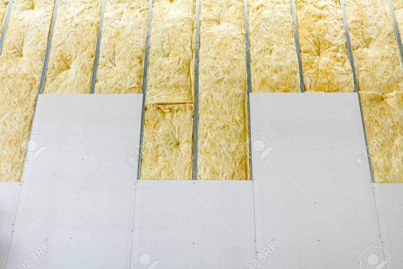 Partitioning with fiberglass insulation in Kenya.